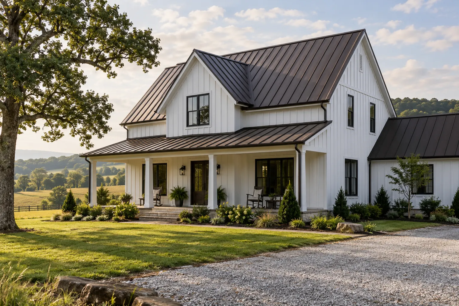 A white farmhouse with a new dark bronze standing-seam metal roof and porch roof.